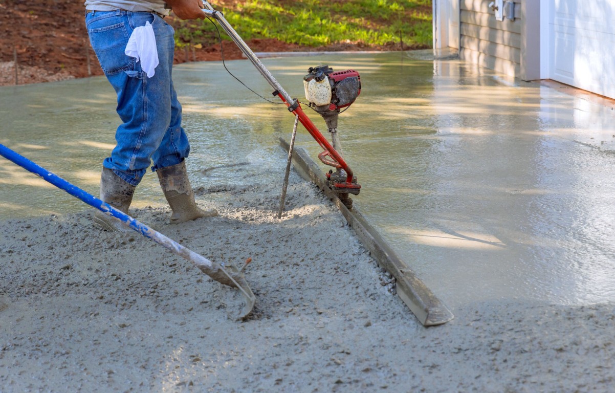 Licensed concrete professionals using precision equipment